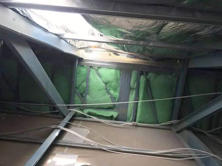 Green polyester acoustic batts installed in a steel-frame internal wall cavity for soundproofing, Comfort Zone