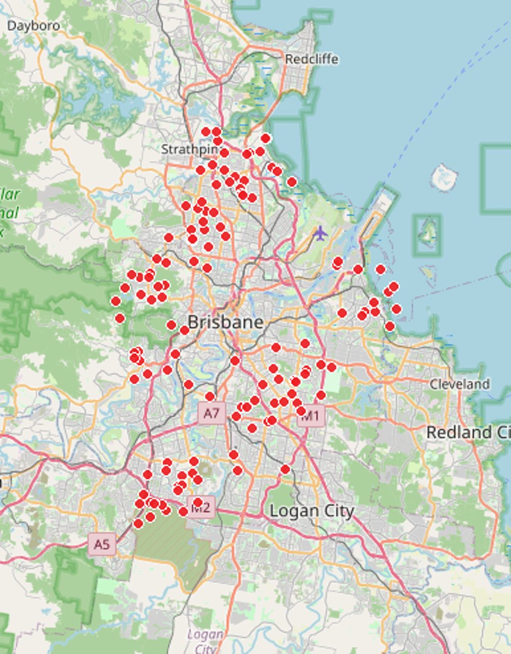 Map of Brisbane dotted with red pins marking homes Comfort Zone Insulation has helped — across the western suburbs (The Gap, Kenmore, Ashgrove), the north (Aspley, Bracken Ridge), the south (Forest Lake, Sunnybank), and the bayside (Wynnum, Manly)