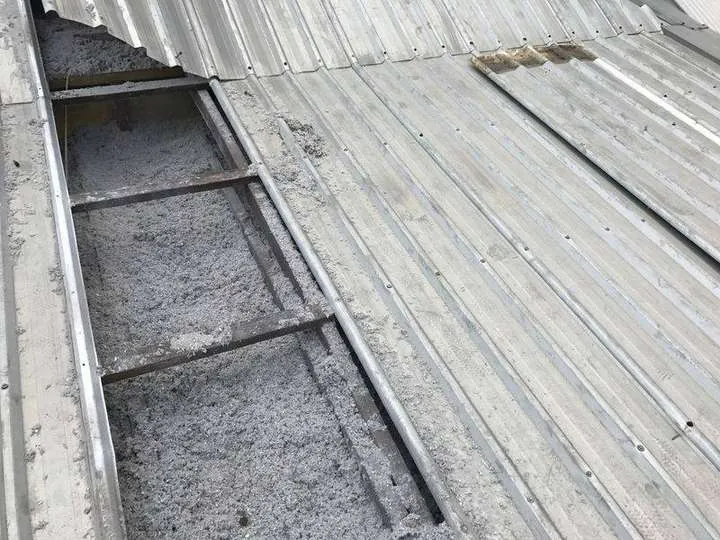 Cellulose insulation blown into a very low-pitch roof where batts cannot be laid — Windsor, 2017