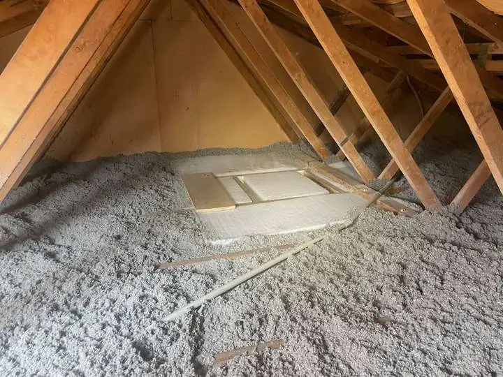 Pale grey cellulose insulation evenly covering a ceiling with a neat protective shroud around the manhole access, Comfort Zone, Sunnybank QLD