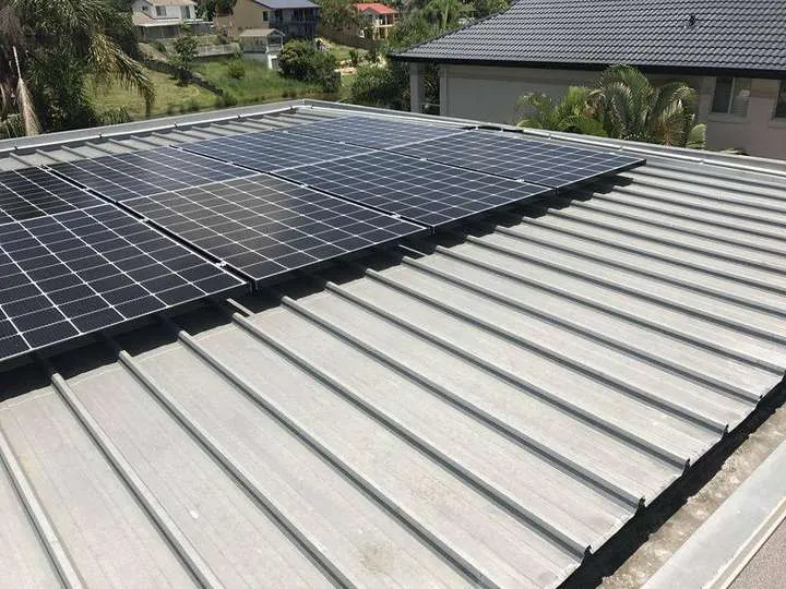 A cliplock metal roof fitted with solar panels, the roof type we insulate around the panels