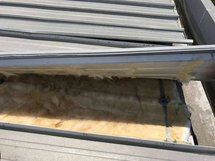 A fibreglass blanket fitted under a cliplock iron roof, the wet, water-tank-risk material we replace