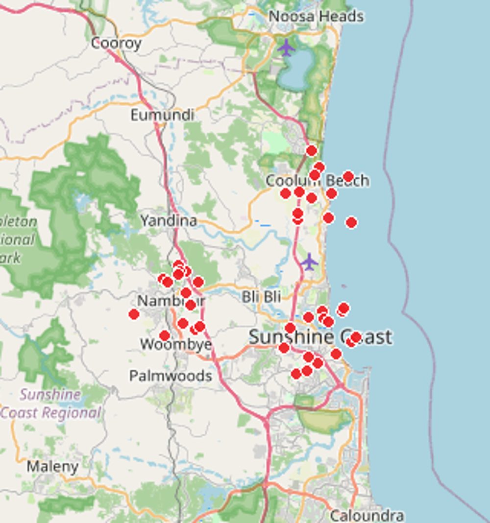 Map of the Sunshine Coast dotted with red pins marking homes Comfort Zone Insulation has helped — from Caloundra and Beerwah up through Buderim, Maroochydore and Nambour to Coolum, Noosa and the Blackall Range hinterland