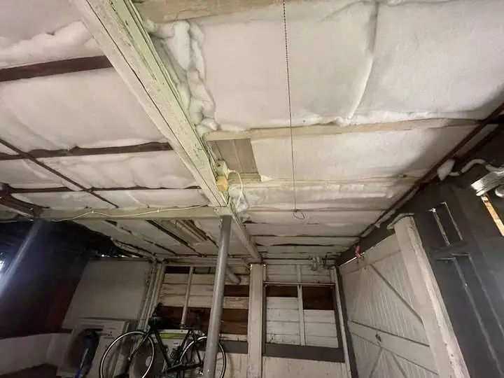 White polyester insulation batts fitted between the joists under a raised timber floor, underfloor install, Moorooka