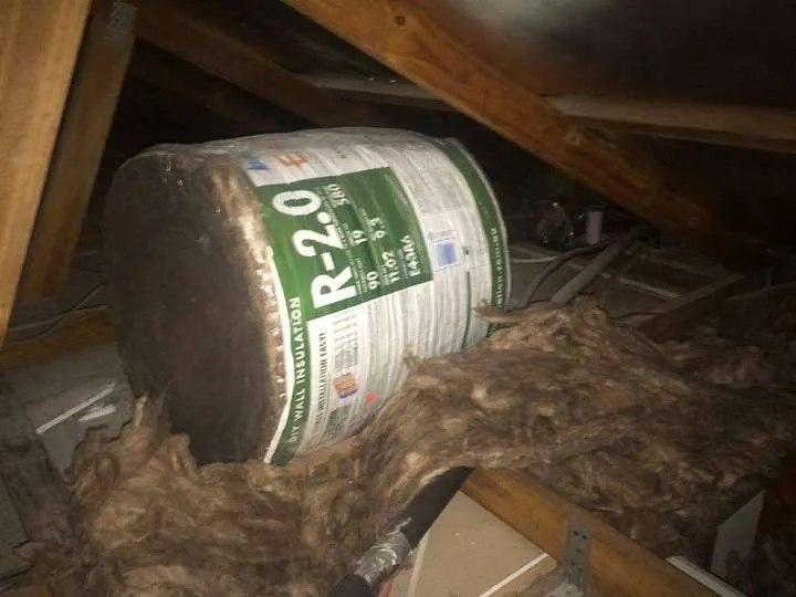 An unopened R2.0 fibreglass batt pack a previous installer left in the roof instead of laying it